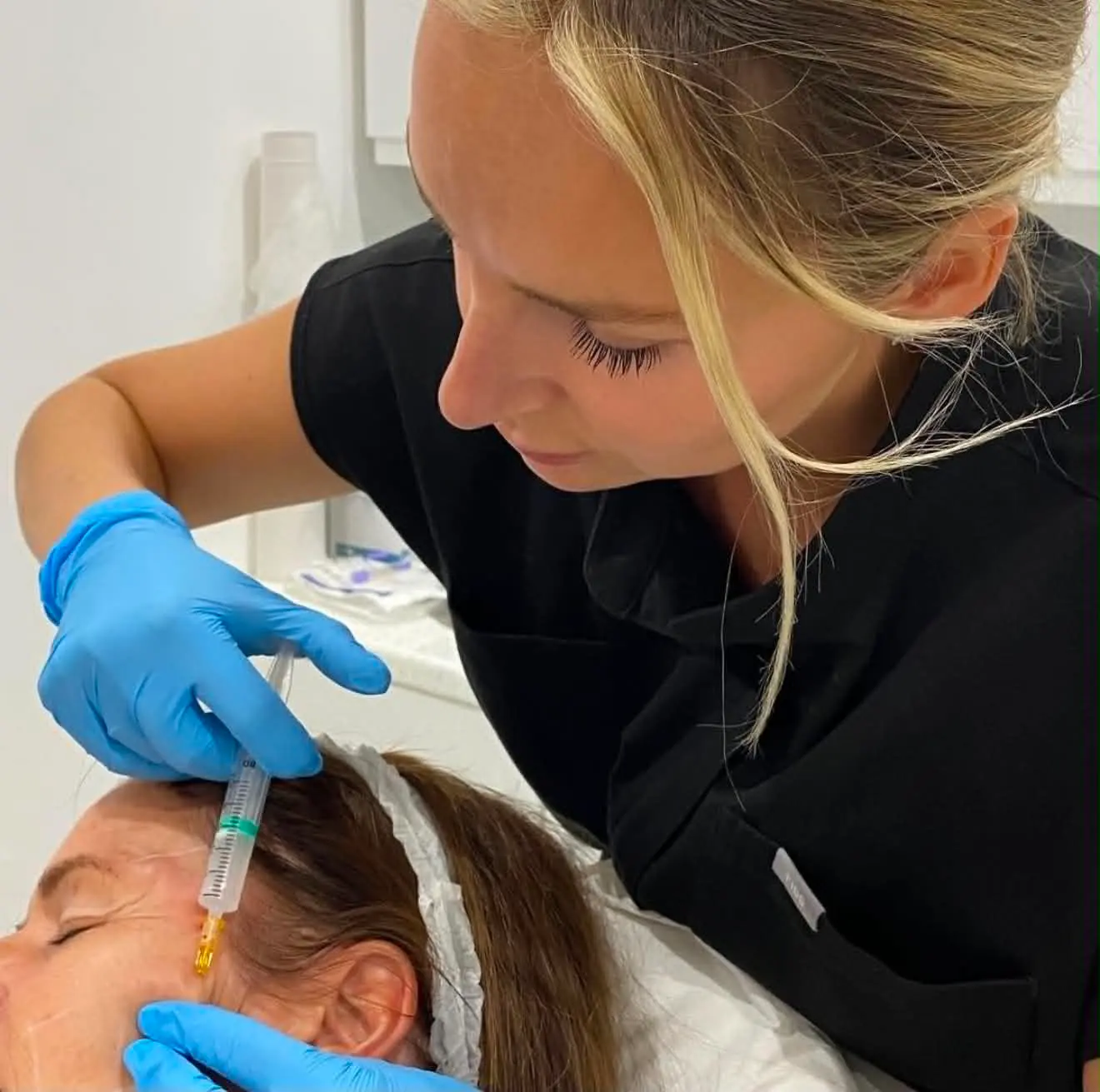 Nurse Danielle performing an advanced facial aesthetics treatment